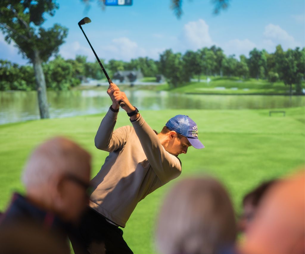 Corporate Indoor Golf Parties Mississauga -People enjoying golf simulator company outing
